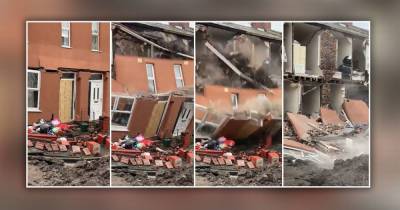 Dramatic footage captures moment house fronts crumble and collapse into Manchester street - hours after sinkhole 'swallowed car' - www.manchestereveningnews.co.uk