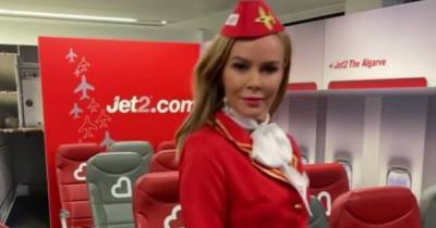 Amanda Holden gives passengers a treat as she dons air hostess uniform - www.ok.co.uk
