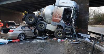 Shocking pictures show BMW trapped under a lorry after five vehicle pile-up which closed the M6 - www.manchestereveningnews.co.uk