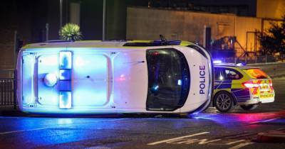 Two officers taken to hospital after crash between police van and BMW - www.manchestereveningnews.co.uk