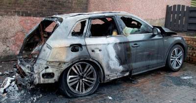 Cars and building destroyed by fire as manhunt launched to find arsonist - www.dailyrecord.co.uk