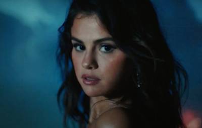 Selena Gomez invites us to dance on Spanish-language song ‘Baila Conmigo’ - www.nme.com - Britain - Spain