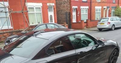 Driver reverses stolen BMW into police car after crashing into two other vehicles during chase - www.manchestereveningnews.co.uk - Manchester