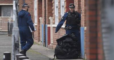Horror at flats after cops find suspected gun and grenades - before block is evacuated and bomb squad called in as huge investigation into organised crime continues - www.manchestereveningnews.co.uk - Manchester