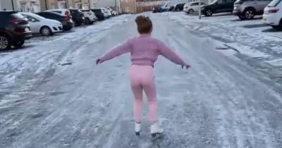 WATCH: East Kilbride schoolgirl dazzles neighbours as she ice skates on her street - www.dailyrecord.co.uk