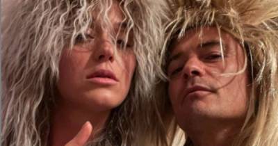 Orlando Bloom and Katy Perry don rock star wigs for playful snap - www.msn.com