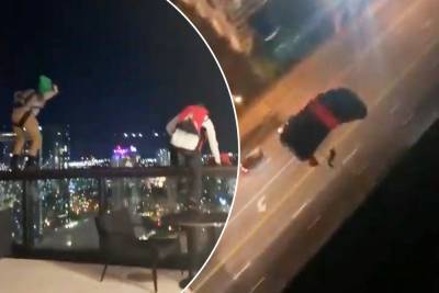 Brave fools banned from hotel after parachuting off roof on New Year’s Day - nypost.com