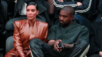 Kim Kardashian Feels 'Overwhelmed' Taking Care of Kanye West, Source Says - www.etonline.com