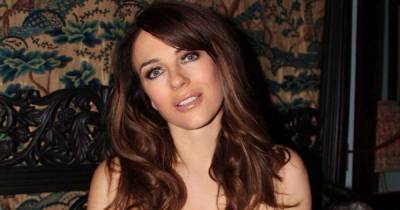 Elizabeth Hurley wows in gorgeous cut-out gown in new teaser video - www.msn.com - Britain