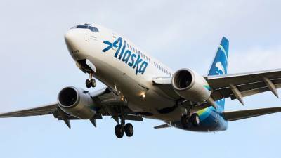Alaska Airlines may ban 14 passengers who refused masks, exhibited 'unacceptable' behavior on flight from DC - www.foxnews.com - state Alaska - Washington - Columbia