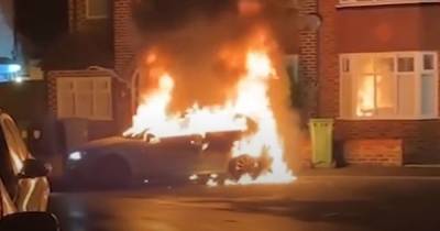 Shocking moment car goes up in flames after it is 'set on fire in random attack' - www.manchestereveningnews.co.uk - Manchester