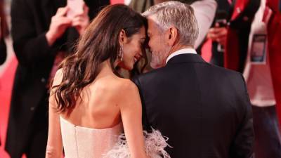 George and Amal Clooney Can't Keep Their Hands Off Each Other on Red Carpet - www.etonline.com