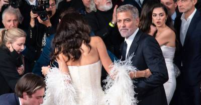 George Clooney Helps Wife Amal Avoid Major Wardrobe Malfunction at ‘The Tender Bar’ Premiere: Photos - www.usmagazine.com - London