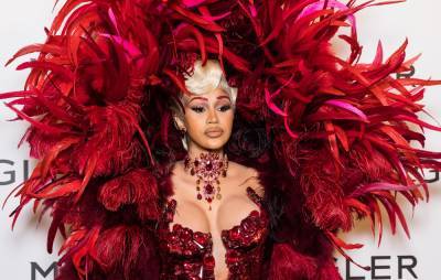 Cardi B defends Paris Fashion Week trip after citing travel safety concerns for pushing back trial date - www.nme.com