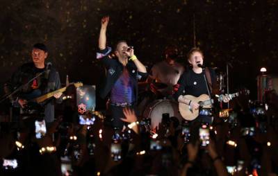 Watch Ed Sheeran join Coldplay for performance of ‘Fix You’ at album launch gig - www.nme.com