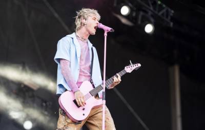 Crowd throws bottles and branches at Machine Gun Kelly during Aftershock set - www.nme.com - California - Sacramento, state California