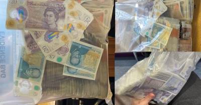 Thousands in cash recovered and designer clothes, luxury watches and cars seized in crackdown - www.manchestereveningnews.co.uk - Manchester