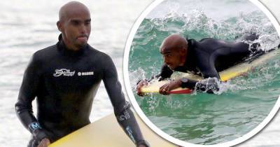 Mo Farah catches some waves on a bodyboard in Cornwall - www.msn.com