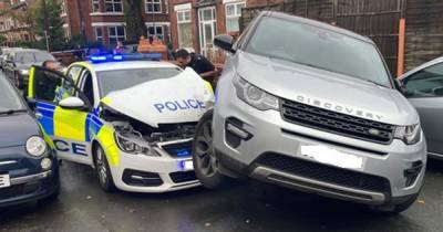 Officer suffers arm injuries after Land Rover rams into police car during pursuit - www.manchestereveningnews.co.uk