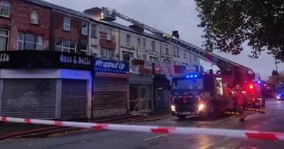 Firefighters spent two hours tackling a roof blaze near a firework shop - www.manchestereveningnews.co.uk - Manchester