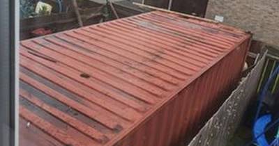 Mum furious as 19ft 'toxic' shipping container winched into neighbour's garden - www.manchestereveningnews.co.uk