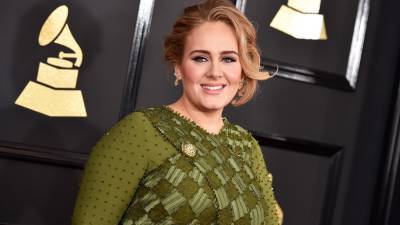 Adele Just Wore a Brown Patterned Louis Vuitton Coat and Matching Purse—And It's So 2000s - www.glamour.com