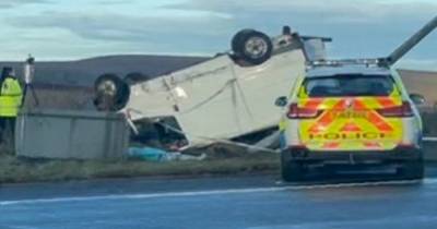 Transit van flips onto its roof after crashing into a lamppost during police chase - www.manchestereveningnews.co.uk
