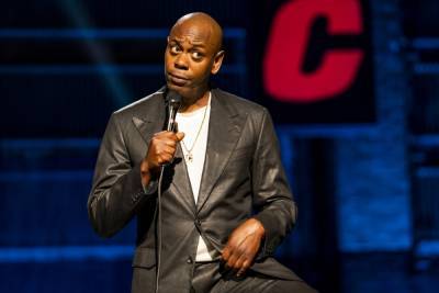 Dave Chappelle Supports The LGBTQ Community But Says “You Will Not Summon Me” To Trans Netflix Group - theplaylist.net