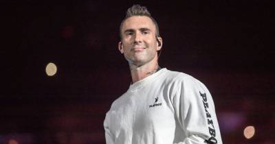 Adam Levine Was Surprised by Maroon 5 Fan Rushing the Stage to Hug Him — See His Reaction - www.usmagazine.com - Los Angeles