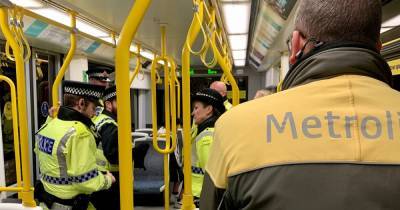 Two arrested and 55 hit with fines in just one night as police tackle problem Metrolink line - www.manchestereveningnews.co.uk