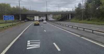 Glasgow’s M77 locked down by cops after two-car crash as man arrested - www.dailyrecord.co.uk
