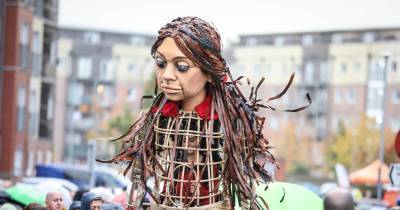 Best photos as hundreds brave weather to welcome giant refugee puppet Little Amal to Wigan - www.manchestereveningnews.co.uk