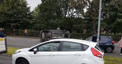 Driver flees scene after car flips over in dramatic crash in Rochdale - www.manchestereveningnews.co.uk