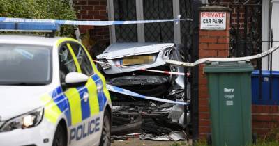 Car 'repeatedly' reversed into wall of Bury house by baseball bat-wielding thugs in 'shocking' attack - www.manchestereveningnews.co.uk - Manchester