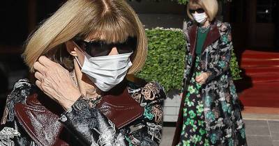 Anna Wintour looks elegant in flowing floral coat and brown boots - www.msn.com - Paris