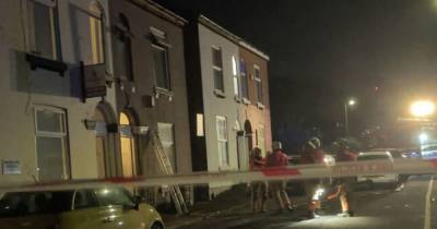 Man arrested on suspicion of arson after Salford fire - neighbours say they heard a 'loud bang' before the house went up in flames - www.manchestereveningnews.co.uk - city Charlestown