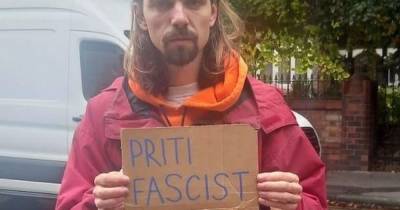 Protester with sign labelling Priti Patel a fascist 'bundled' into police van at Tory party conference - www.manchestereveningnews.co.uk