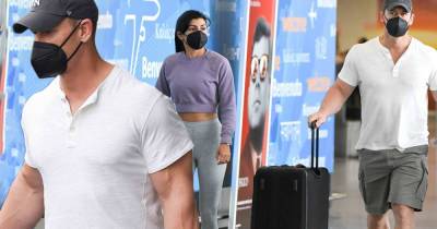 John Cena - Jess Wright - John Cena flashes his biceps at airport with wife Shay in New York - msn.com - Spain - New York - Florida - Canada - city Tampa, state Florida