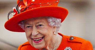The Queen dons bright orange ensemble for engagement at Buckingham Palace - www.ok.co.uk - Birmingham