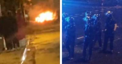 Gang of youths hurl fireworks at residents and police as riot cops descend on street in Halloween night chaos - www.manchestereveningnews.co.uk - Manchester