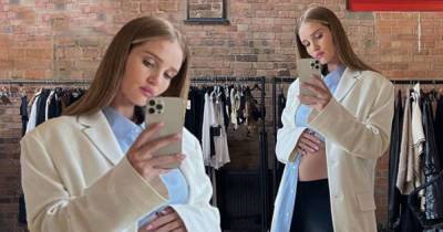 Pregnant Rosie Huntington-Whiteley displays her growing bump - www.msn.com