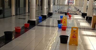 'More buckets than people'...woman's hilarious pictures show leak-ridden shopping centre with no customers - www.manchestereveningnews.co.uk