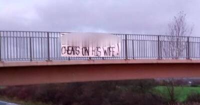 Roaming Scots hubby shamed as cheater in massive banner over motorway bridge - www.dailyrecord.co.uk - Scotland