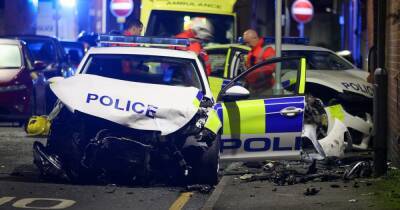 At least one officer injured after police car crashes into house and another is written off in horror collision - www.manchestereveningnews.co.uk