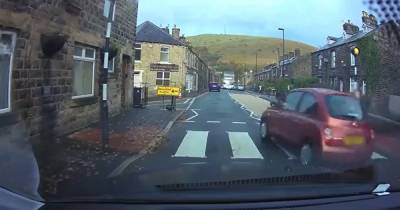 Footage shows woman and child's narrow escape as Nissan Micra ploughs over zebra crossing - www.manchestereveningnews.co.uk - Britain - Manchester - city Greenfield
