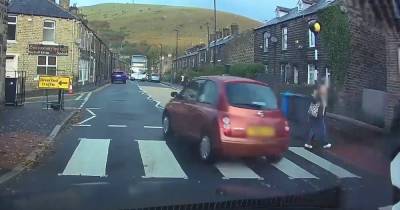 Footage shows terrifying moment reckless driver narrowly misses woman and child at crossing - www.dailyrecord.co.uk - county Valley - Manchester