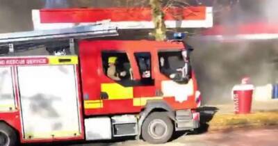 Watch as firefighters rush to tackle blaze at petrol station - www.manchestereveningnews.co.uk