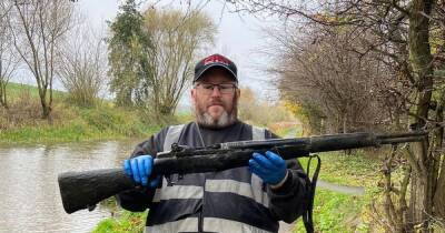 Scots fisherman triggers police alert after pulling WW2 rifle from city canal - www.dailyrecord.co.uk - Scotland
