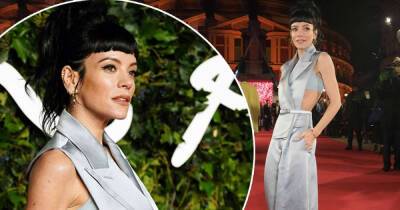 Lily Allen models a backless silver jumpsuit at the Fashion Awards - www.msn.com