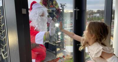 Heartwarming moment Santa uses crane to meet kids at Scots hospital with indoors visits not allowed - www.dailyrecord.co.uk - Scotland - Santa